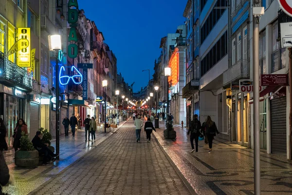 stock image Oporto, Portugal. April 13 , 2022: Rua de Santa Catarina street at night and people walking.