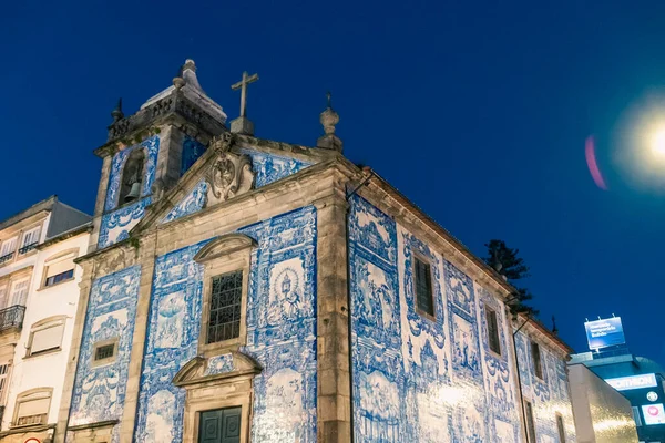 stock image Oporto, Portugal. April 13 , 2022: Chapel of Souls with blue sky, night view.