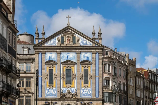 stock image Oporto, Portugal. April 12 , 2022: Church of the azulejos congregados and blue sky.