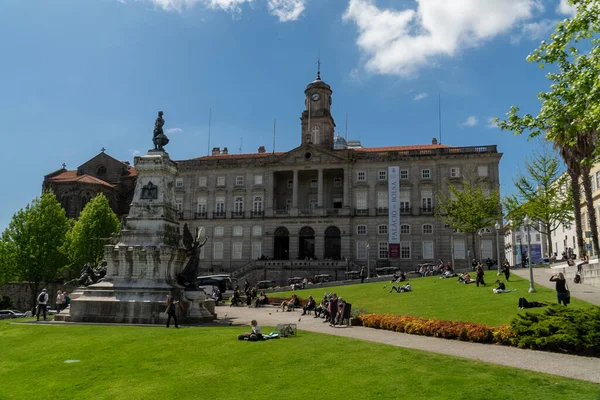 stock image Oporto, Portugal. April 13, 2022: Stock Exchange Palace and Don Henrique Statue.