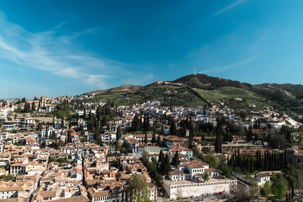 stock image Granada,Spain. April 14, 2022:  Albaicin neighborhood architecture and blue sky. Panoramic landscape of the neighborhood.