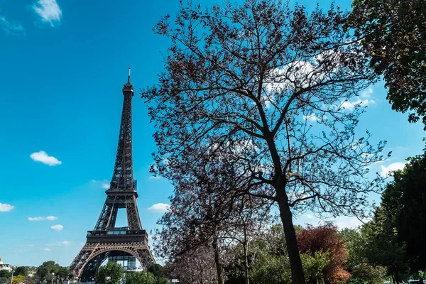 stock image Paris, France. April 22, 2022: Landscape with a view of the Eiffel Tower and beautiful blue summer sky.