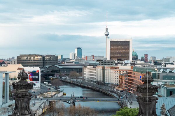 Berlin, Germany: April 20, 2022: Spree river panorama with bridge.