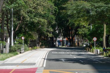 Medellin, Antioquia, Colombia. July 20, 2020: La Playa avenue and bike lane in quarantine days.