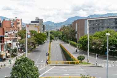 Medellin, Antioquia, Colombia. July 20, 2020: Nutibara avenue with green corridor in quarantine days.