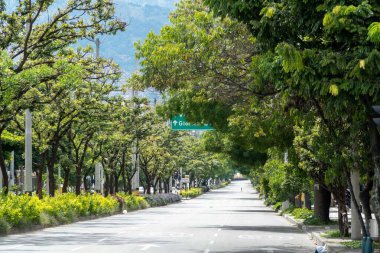 Medellin, Antioquia, Colombia. July 20, 2020: 33rd Avenue. Cityscape of avenue and mountains with sky.