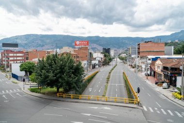 Medellin, Antioquia, Colombia. July 20, 2020: 33rd Avenue. Cityscape of avenue and mountains with sky.