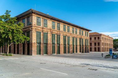 Medellin, Antioquia, Colombia. July 18, 2020: Vasquez and Carre buildings in cisneros square. Beautiful blue sky.