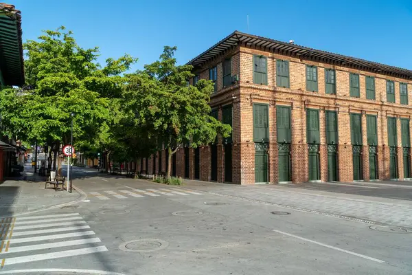 Medellin, Antioquia, Colombia. July 18, 2020: Vasquez and Carre buildings in cisneros square. Beautiful blue sky.