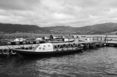 Boats of la Cocha lagoon, San Juan de Pasto, Narino Colombia clipart