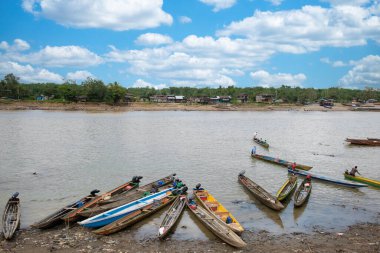 Choc, Quibdo, Colombia. March 4, 2020: Fishermen on the shore of the Atrato river.  clipart