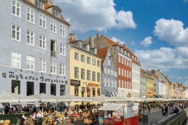 Copenhague, Denmark. September 26, 2019: Colorful architecture and Nyhavn canal with blue sky. clipart