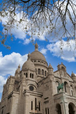 Paris, France. April 24, 2022: Sacr Cur Basilica and blue sky. clipart