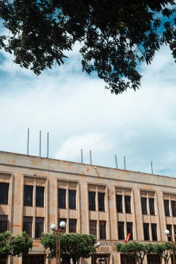 Cucuta, North Santander, Colombia. June 29, 2008: Architecture and facades of the city with blue sky. clipart