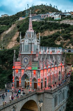 Ipiales, Narino, Colombia. June 26, 2024: Sanctuary of Our Lady of the Rosary of Las Lajas illuminated with its colorful lights. clipart