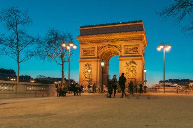 Paris, France. March 24, 2011: Arc de Triomphe on a beautiful blue afternoon. clipart