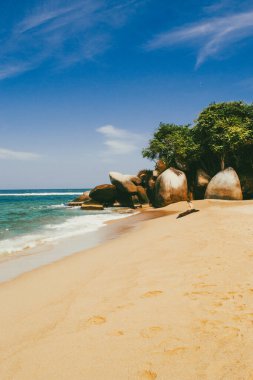 Beautiful landscape with ocean view and blue sky on the beaches of Tayrona Park. Santa Marta, Colombia. clipart