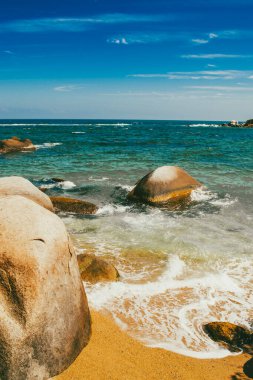 Beautiful landscape with ocean view and blue sky on the beaches of Tayrona Park. Santa Marta, Colombia. clipart