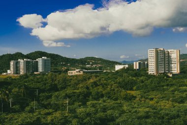 Santa Marta, Magdalena, Colombia. September 19, 2024: red holes in construction sites and blue sky. clipart