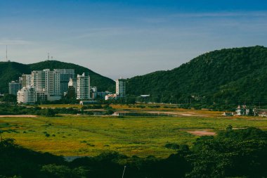 Santa Marta, Magdalena, Colombia. September 19, 2024: red holes in construction sites and blue sky. clipart