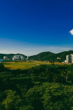 Santa Marta, Magdalena, Colombia. September 19, 2024: red holes in construction sites and blue sky. clipart