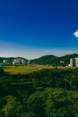 Santa Marta, Magdalena, Colombia. September 19, 2024: red holes in construction sites and blue sky. clipart