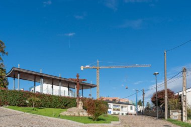 Portomarin, Spain. November 5, 2024: Construction cranes and blue sky. clipart