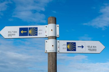 Portomarin, Spain. November 5, 2024: Signposting of the Camino de Santiago and Portomarn. clipart