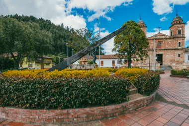 Nemocon, Cundinamarca, Colombia. July 2, 2021: Facade of San Francisco de Ass church and blue sky.