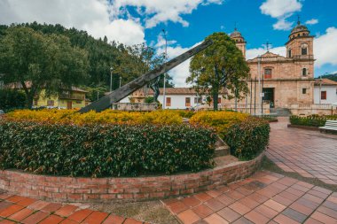 Nemocon, Cundinamarca, Colombia. July 2, 2021: Facade of San Francisco de Ass church and blue sky.