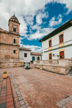 Nemocon, Cundinamarca, Colombia. July 2, 2021: Facade of San Francisco de Ass church and blue sky.