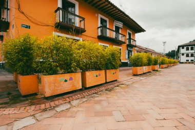 Nemocon, Cundinamarca, Colombia. July 2, 2021: Facade of San Francisco de Ass church and blue sky.