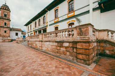 Nemocon, Cundinamarca, Colombia. July 2, 2021: Facade of San Francisco de Ass church and blue sky.