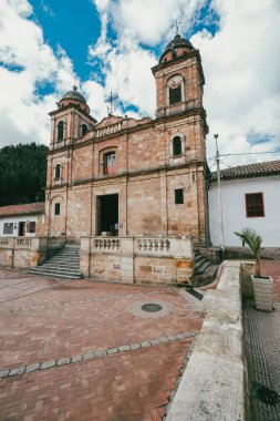 Nemocon, Cundinamarca, Colombia. July 2, 2021: Facade of San Francisco de Ass church and blue sky.