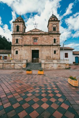 Nemocon, Cundinamarca, Colombia. July 2, 2021: Facade of San Francisco de Ass church and blue sky.