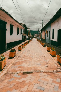 Nemocon, Cundinamarca, Colombia. July 2, 2021: Facade of San Francisco de Ass church and blue sky.