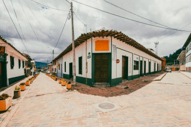 Nemocon, Cundinamarca, Colombia. July 2, 2021: Facade of San Francisco de Ass church and blue sky.