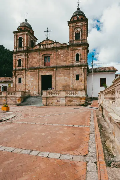 Nemocon, Cundinamarca, Colombia. July 2, 2021: Facade of San Francisco de Ass church and blue sky.