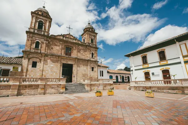 Nemocon, Cundinamarca, Colombia. July 2, 2021: Facade of San Francisco de Ass church and blue sky.