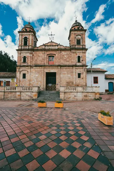 Nemocon, Cundinamarca, Colombia. July 2, 2021: Facade of San Francisco de Ass church and blue sky.