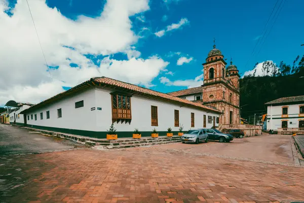 Nemocon, Cundinamarca, Colombia. July 2, 2021: Facade of San Francisco de Ass church and blue sky.