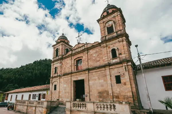 Nemocon, Cundinamarca, Colombia. July 2, 2021: Facade of San Francisco de Ass church and blue sky.