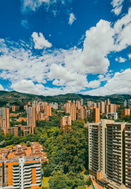 Medellin, Antioquia, Colombia. July 17, 2020: Landscape with blue sky and buildings in Medellin, in the town.