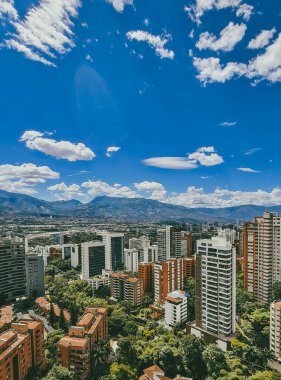 Medellin, Antioquia, Colombia. July 17, 2020: Landscape with blue sky and buildings in Medellin, in the town.