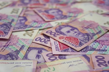Ukrainian money background. banknotes with a face value of 200 hryvnia money background. Ukrainian money. Business concept. Background with hryvnia. Pink-blue