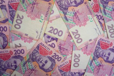 Ukrainian money background. banknotes with a face value of 200 hryvnia money background. Ukrainian money. Business concept. Background with hryvnia. Pink-blue
