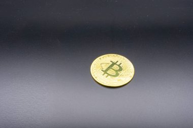 Crypto currency golden coin with bitcoin symbol on isolated on black background. Bitcoin Coin on black background. Bitcoin cryptocurrency. Cryptocurrency Coin Concept. single golden valuable