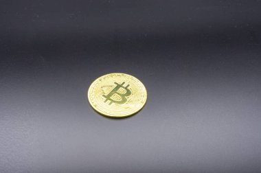 Crypto currency golden coin with bitcoin symbol on isolated on black background. Bitcoin Coin on black background. Bitcoin cryptocurrency. Cryptocurrency Coin Concept. single golden valuable
