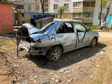 KHARKIV, UKRAINE - May, 08, 2022: Burned and broken cars. War in Ukraine 2022. Russian missiles in Kharkiv Ukraine. Russian aggression, conflict. Russian attack on Ukraine.