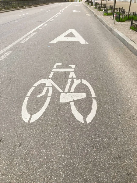 Bicycle lane sign in the roadway. Place for cyclists to pass. Bicycle sign on the road
